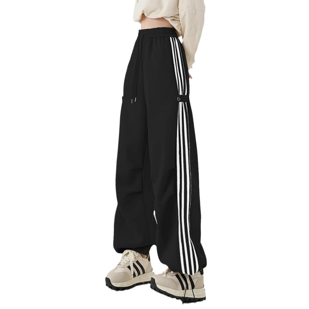 Wide-leg black cotton sweatpants with white stripes, perfect for summer workwear and casual style.