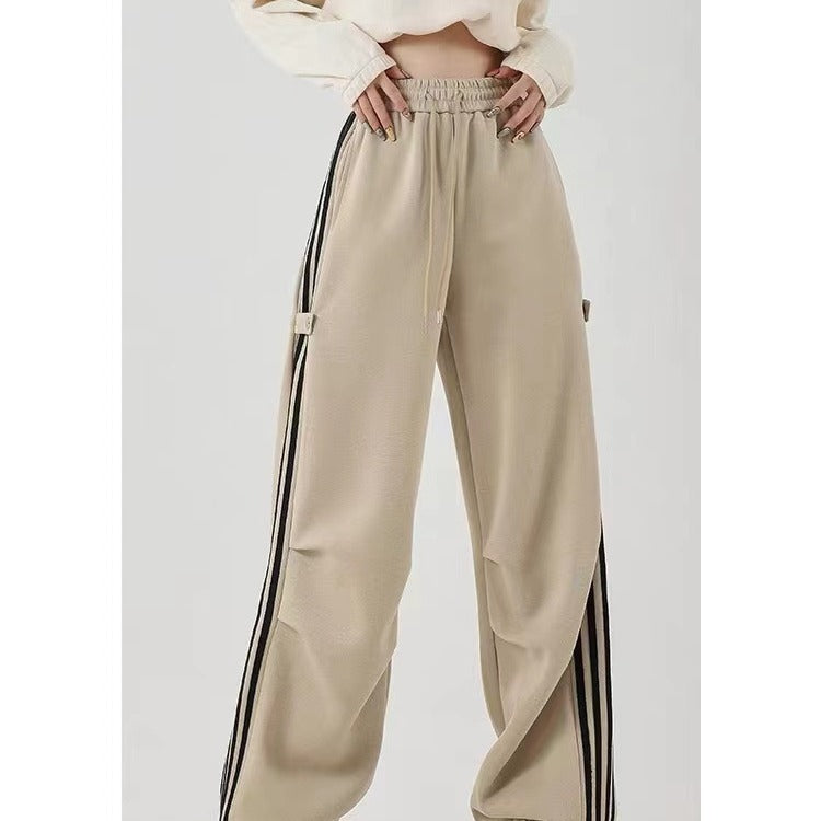 Wide-leg khaki cotton sweatpants with side stripes for summer workwear, featuring an elastic waistband.
